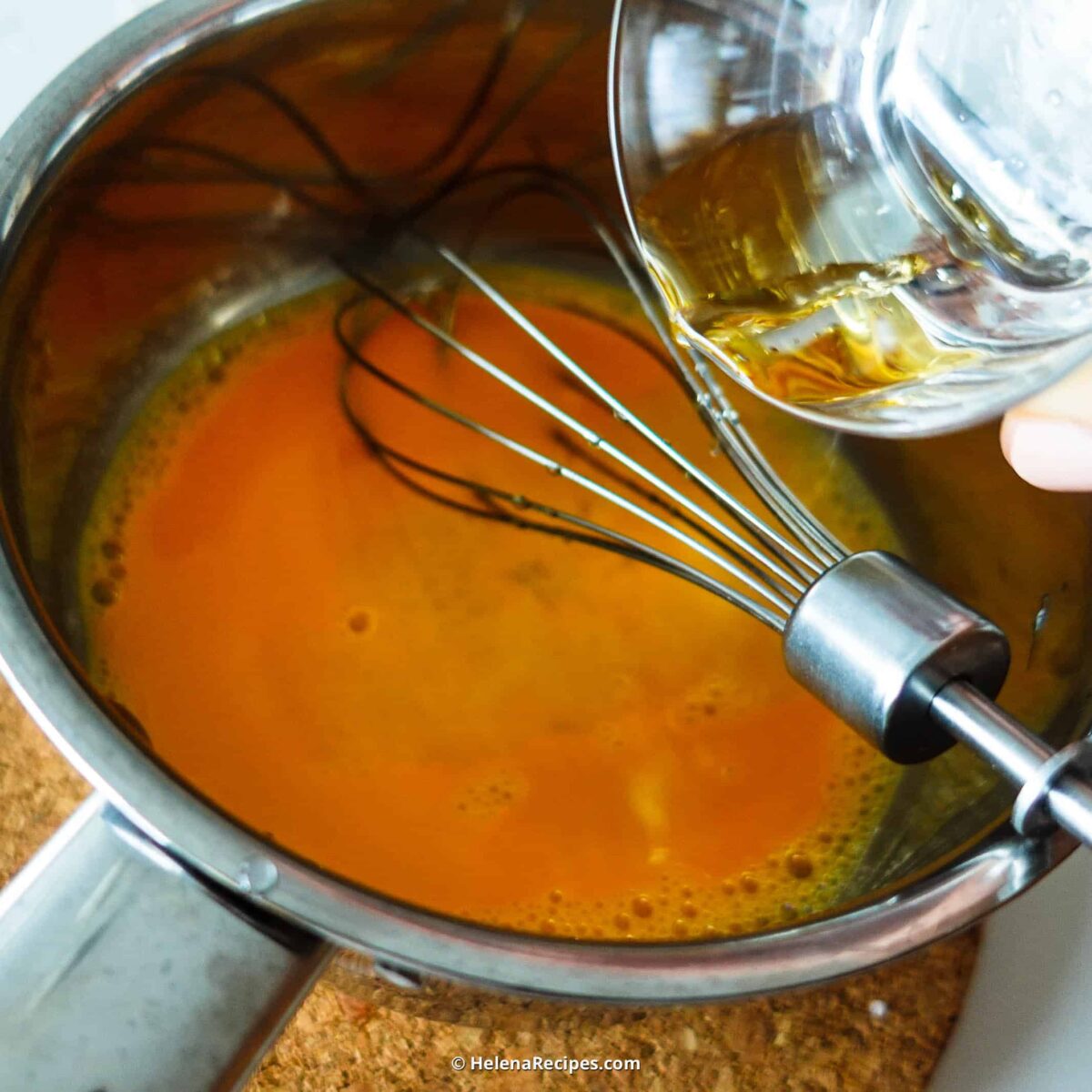 Step 3. Add egg yolks to saucepan 