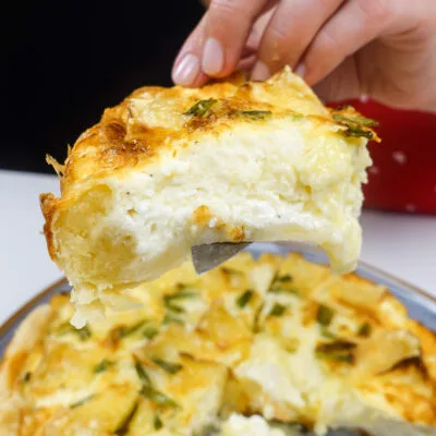 A piece of camambert quiche on a plate.