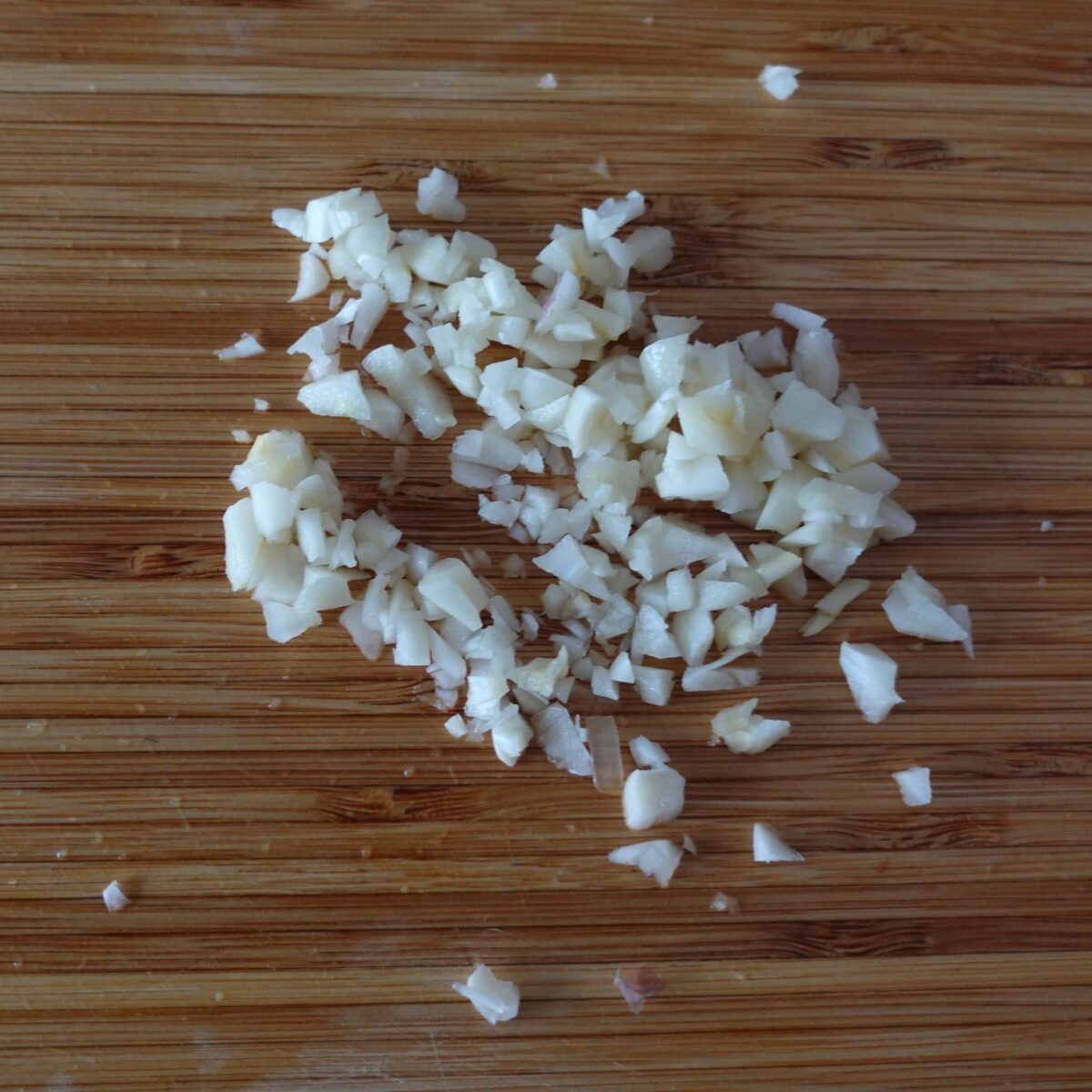 Step 5. Add water, paste and garlic