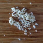 Step 5. Add water, paste and garlic