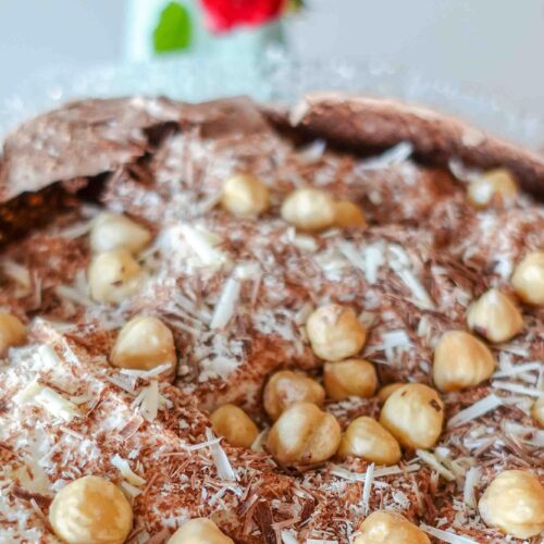 Mouthwatering Chocolate Hazelnut Pavlova on a beautiful plate