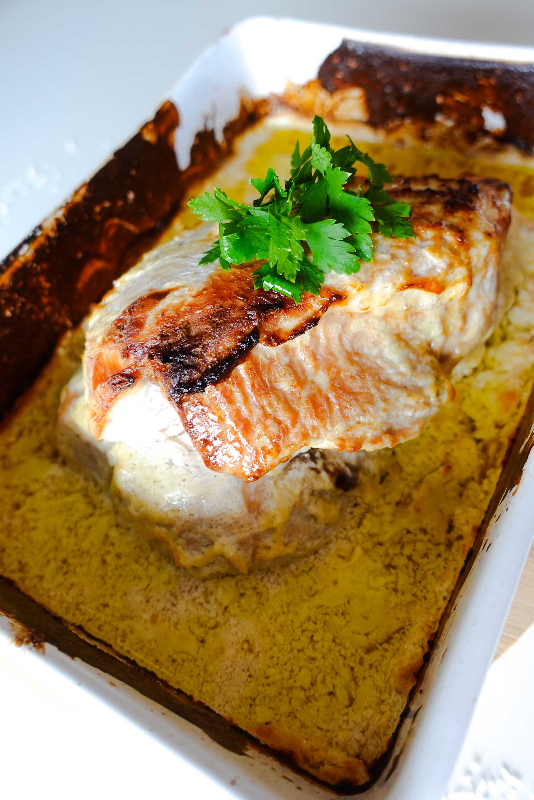 Honey Baked Turkey Breast in a baking pan with sauce