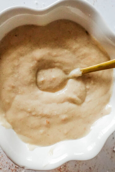 Bechamel Sauce in a bowl with spoon
