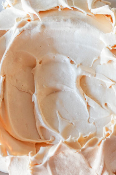 Ready pavlova shell meringue on a white plate