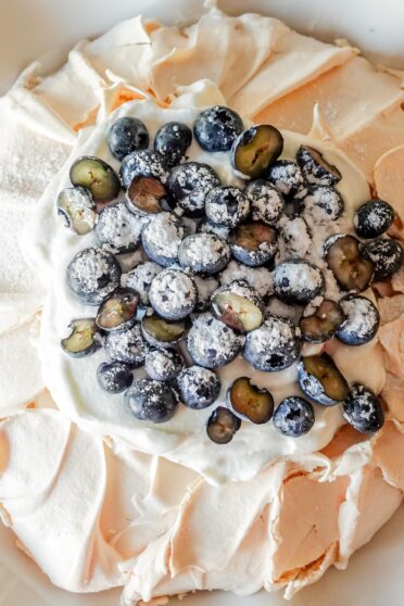 Blueberry Pavlova on a plate.