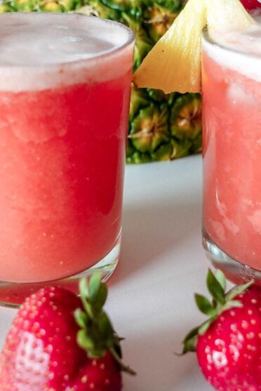 Rum Pineapple Strawberry Cocktail made at home and served with fresh strawberries