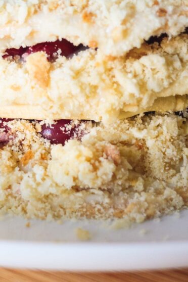 Cut napoleon cake with cherries