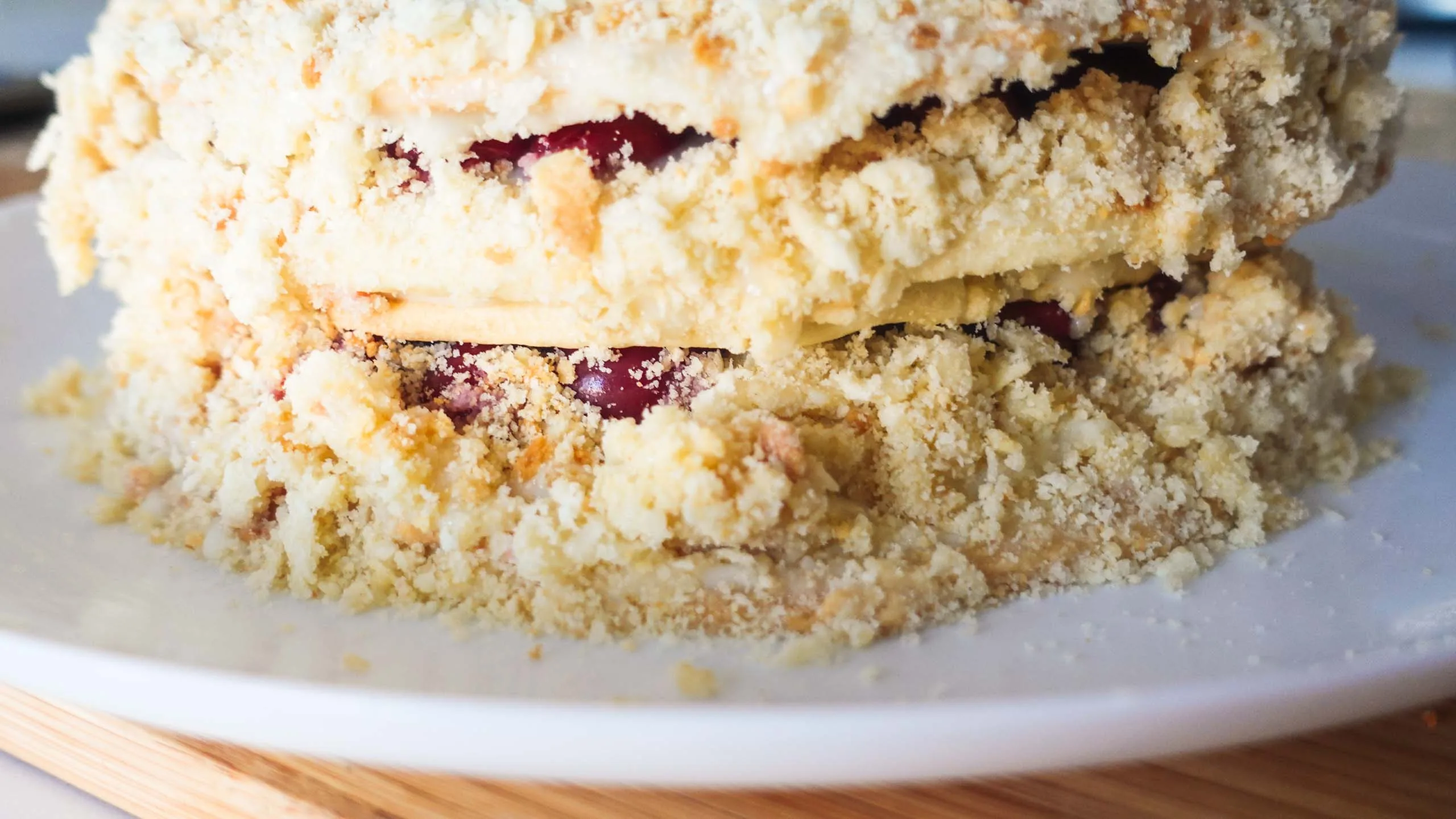 Cut napoleon cake with cherries
