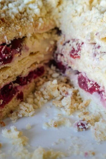 Cut napoleon cake with cherries