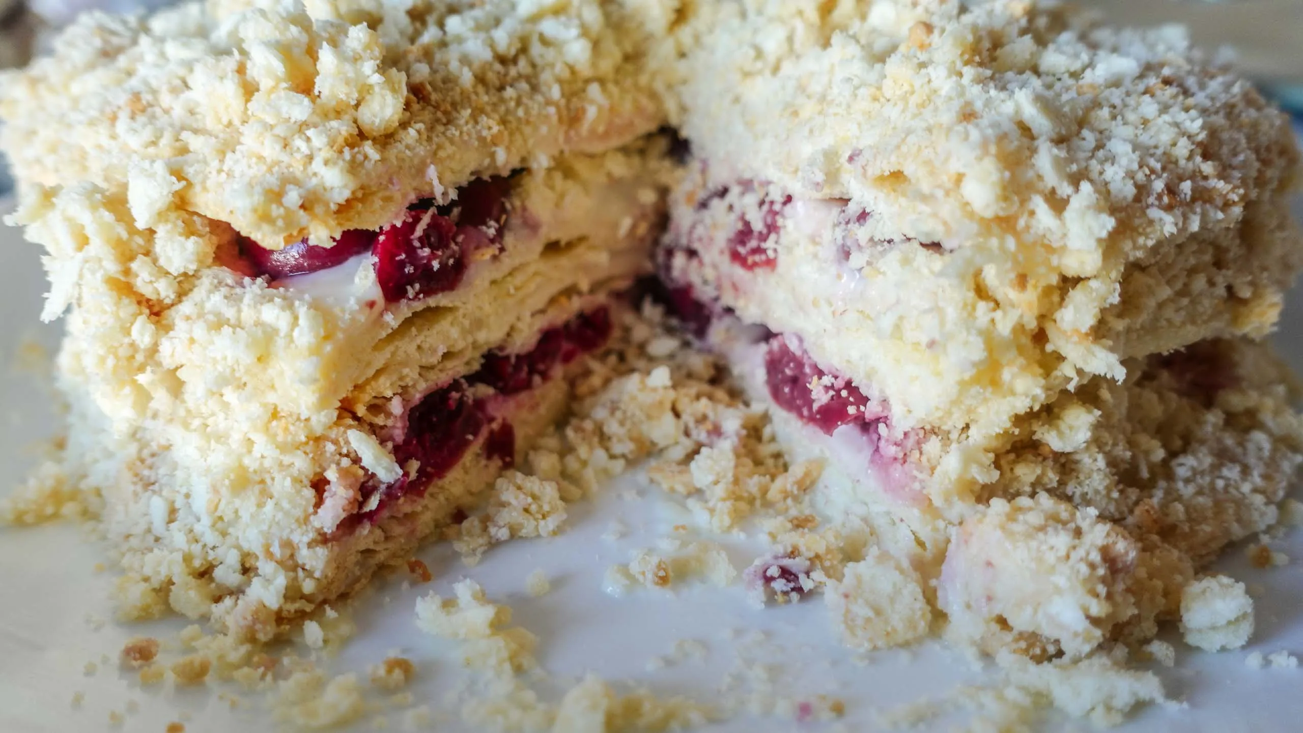 Cut napoleon cake with cherries