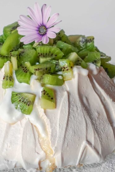 Pavlova with flowers on a plate
