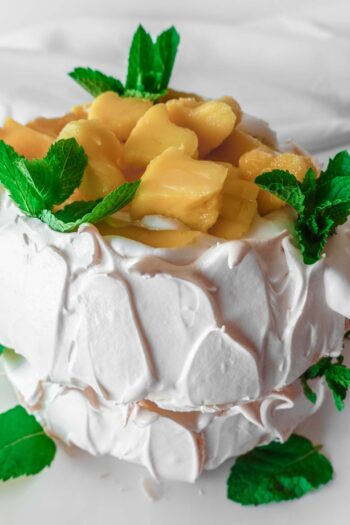 Mango Pavlova on a white plate