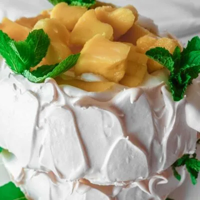 Mango Pavlova on a white plate
