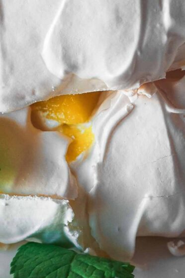 Double mango pavlova on a plate