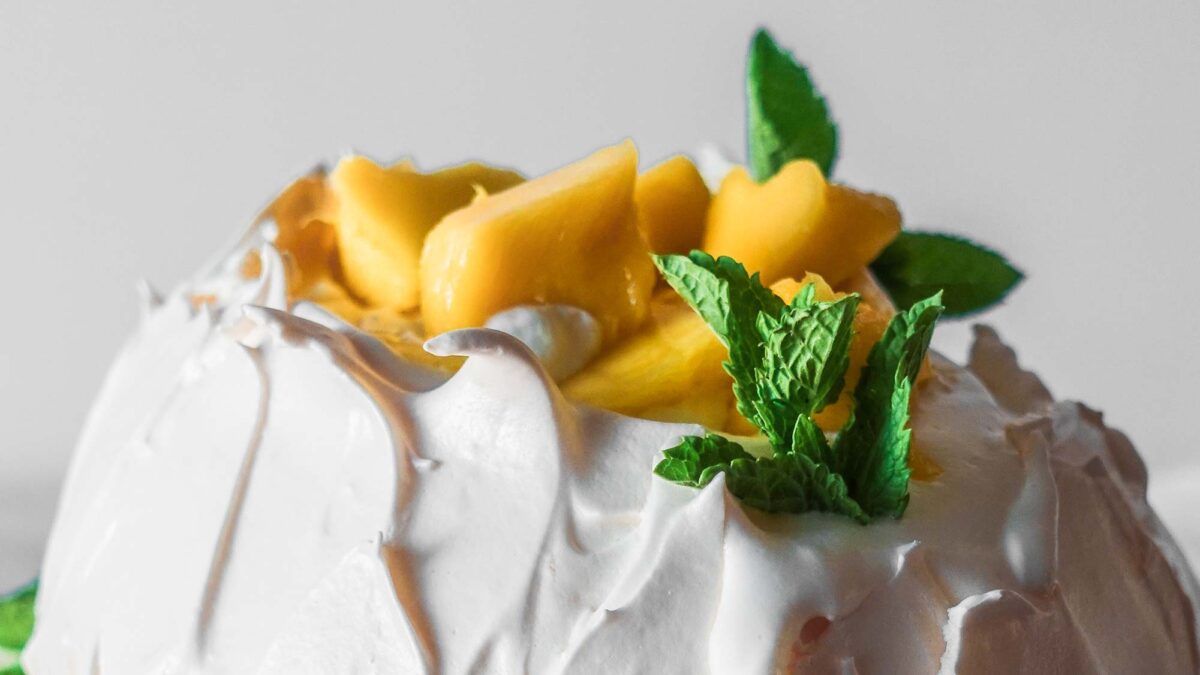 Mango pavlova with two layers and mango on top