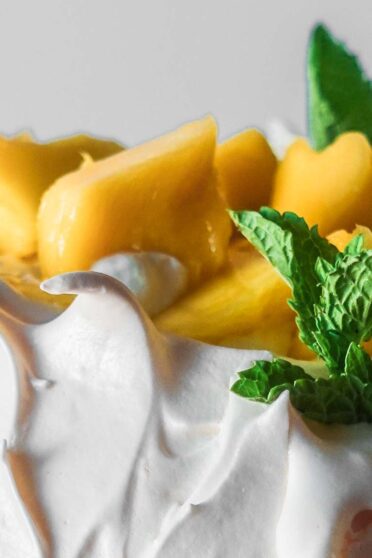 Mango pavlova with two layers and mango on top