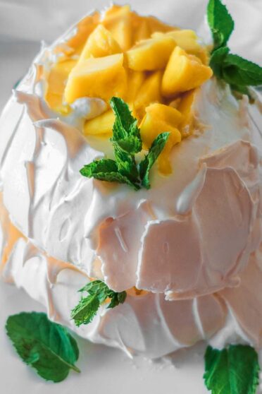 Mango pavlova with two layers.