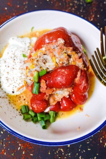 Stuffed Peppers with Ground Beef and Rice Recipe in a bowl with yogurt.