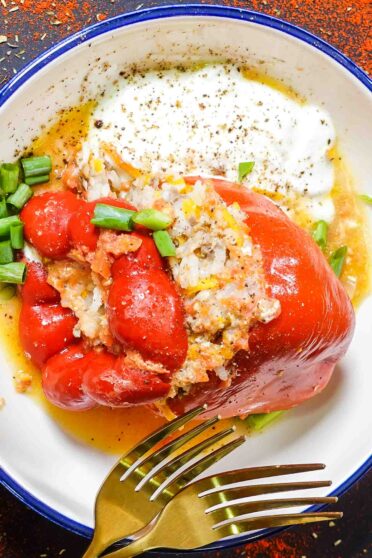 Stuffed Peppers with Ground Beef and Rice Recipe in a bowl with yogurt.