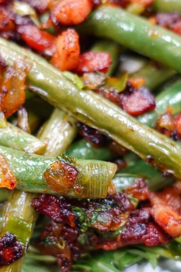 Delicious French Green Beans with Bacon on a plate with a fork