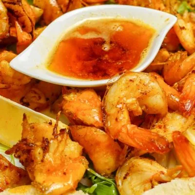 Garlic Butter Shrimp with a bowl of sauce.