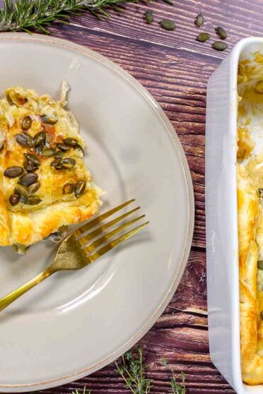 Baked leek and mushroom pie on a plate and in a form.