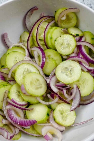 Cucumber Red Onion Salad Recipe in a big white bowl.