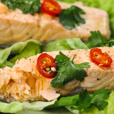 Poached Salmon on a plate with salad.