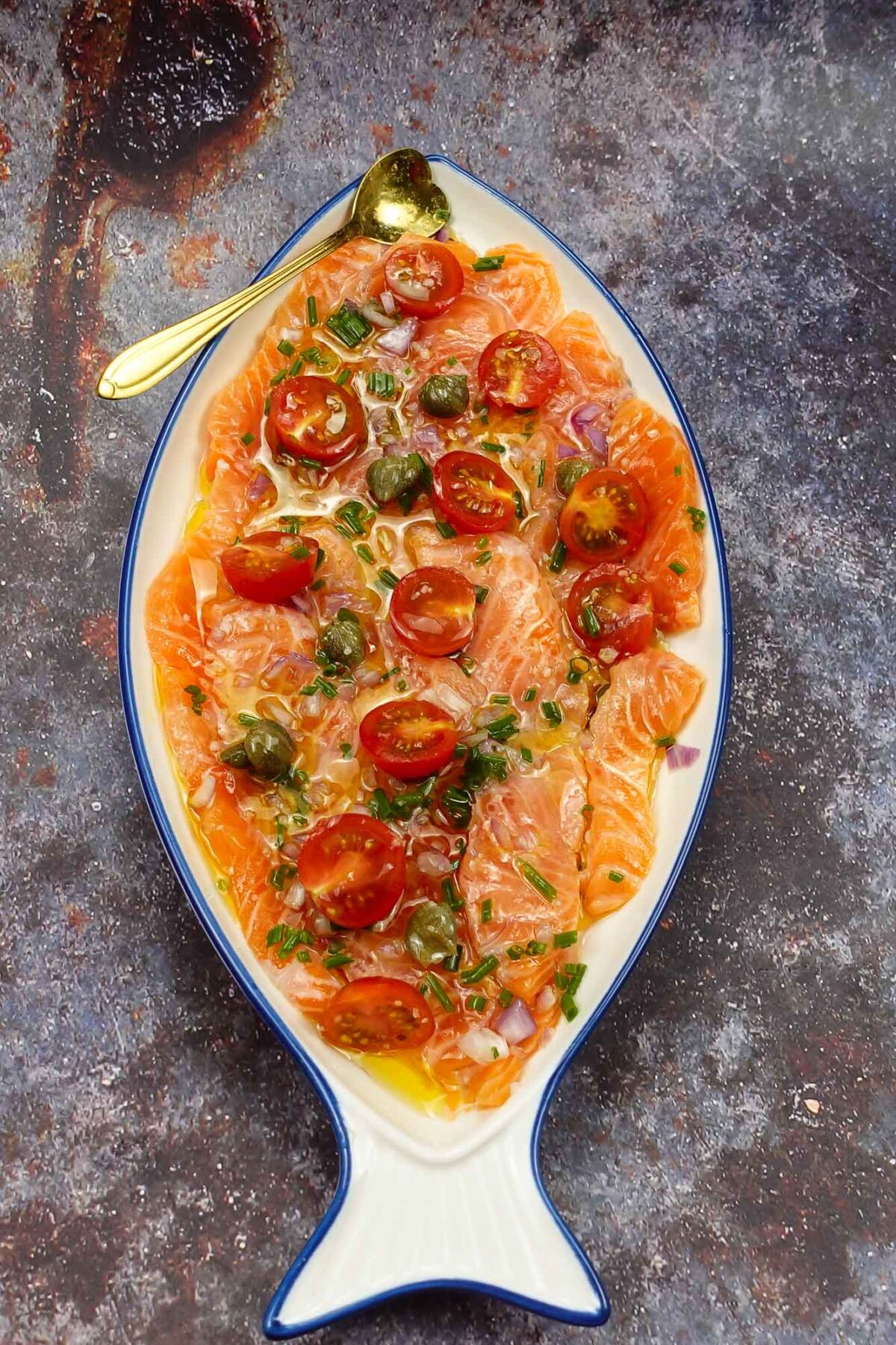 Mouthwatering salmon on a plate with a spoon.