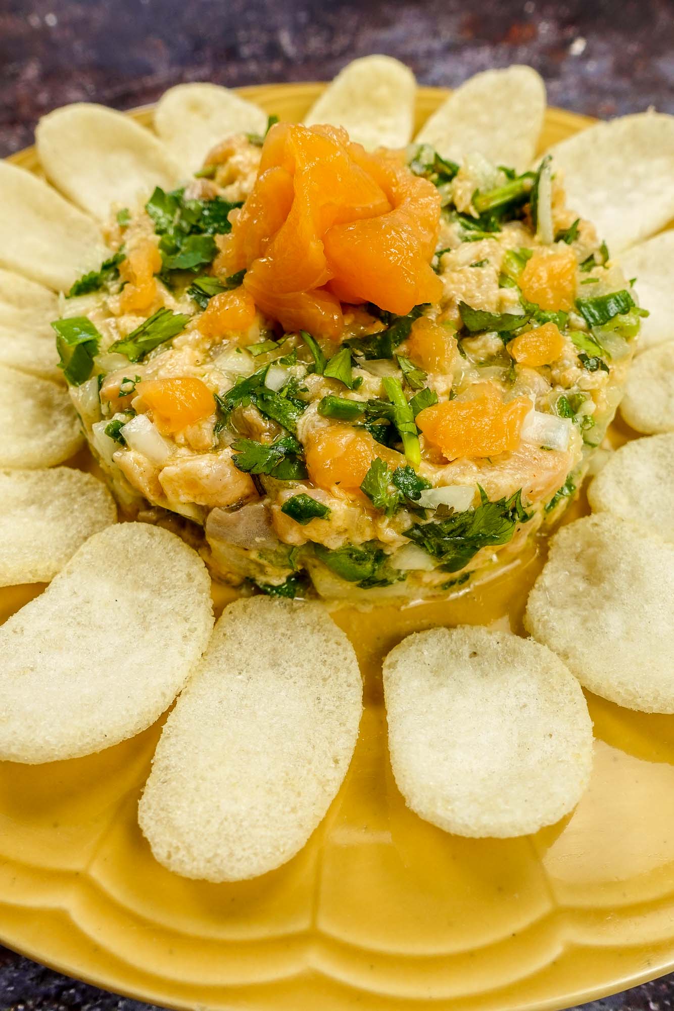 Mediterranean Salmon Tartare with chips on a plate.