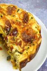 Chorizo Asparagus Quiche on a plate.
