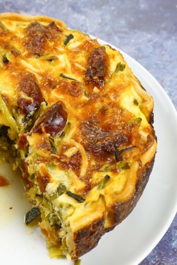 Chorizo Asparagus Quiche on a plate.