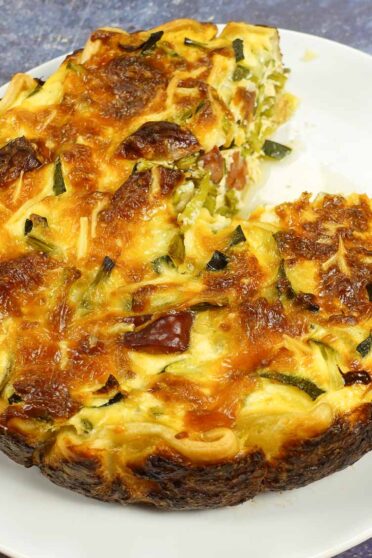 Chorizo Asparagus Quiche on a white plate