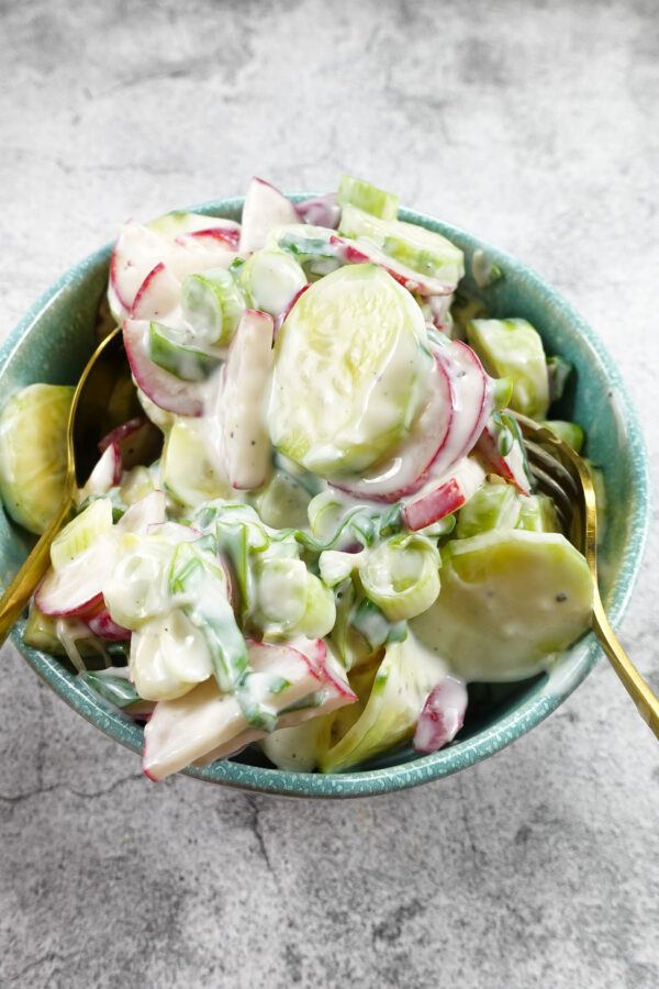 Creamy Cucumber Radish Salad in a blue bowl.