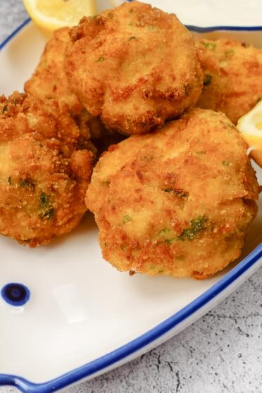 Mediterranean Shrimp Croquettes with a sauce in a bowl.