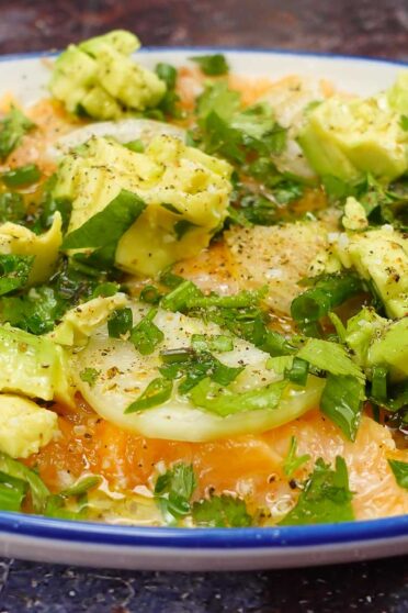 Avocado Salmon Carpaccio on a plate.