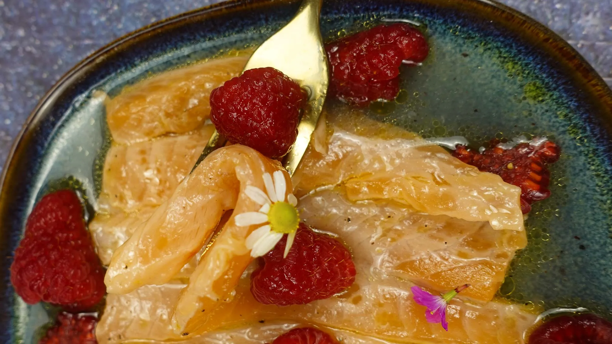 A forkful of Salmon Crudo with Raspberries