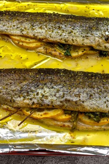 Delicious ready Baked Trout on a tray.