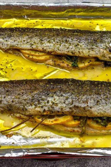 Delicious ready Baked Trout on a tray.