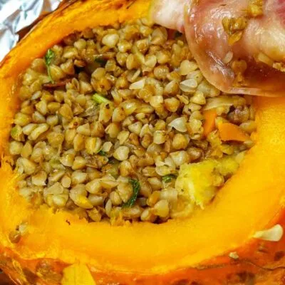 Incredibly delicious stuffed pumpkin with buckwheat and bacon on the side.