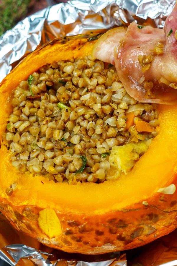 Incredibly delicious stuffed pumpkin with buckwheat and bacon on the side.