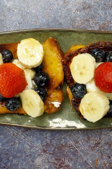 Cinnamon French Toast on a beautiful plate in two hands