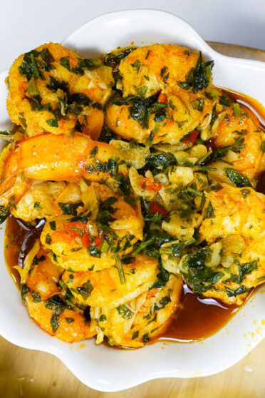 Portuguese Garlic Shrimp in a bowl with clams on a side and bread