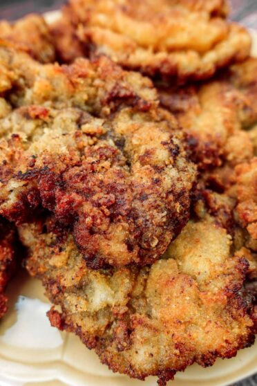 Breaded Beef Steak on a yellow plate