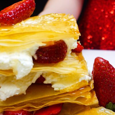 Helena is standing behind strawberry napoleons