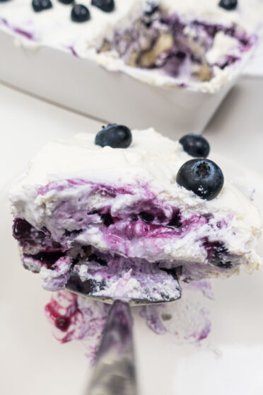 A big spoon of blueberry tiramisu