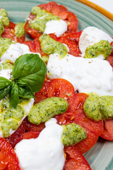Tomato Burrata Salad with pesto on top