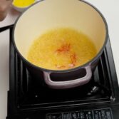 Step 2. Add saffron and reduce