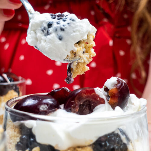 Helena is trying cheesecake with one teaspoon full of berries