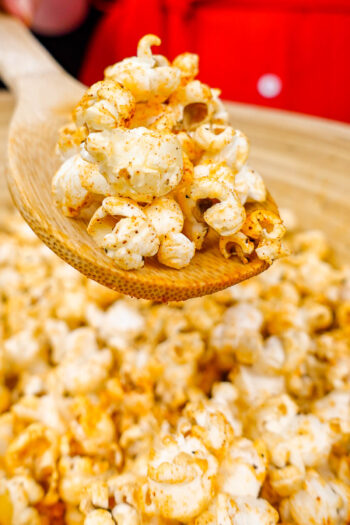 Helena is holding a spoon of truffle oil popcorn
